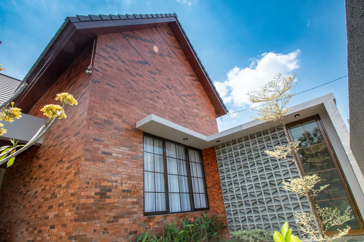 Large modern windows on a brick facade